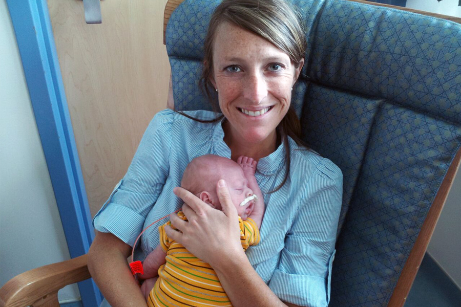 Jamie sumner holding her son with complex medical needs