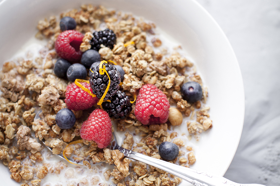 bowl of muesli and fruits with rice milk